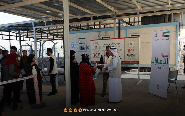 مخيم باسرمة.. بارزاني الخيرية توزع المساعدات النقدية والملابس الشتوية على اللاجئين 