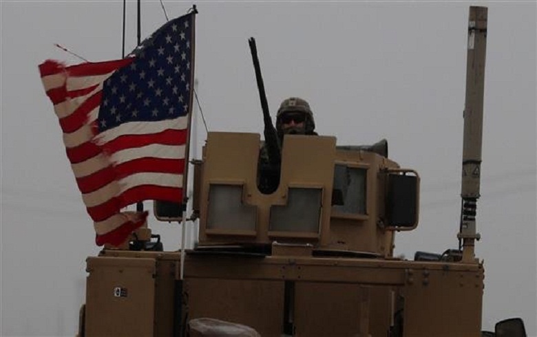 Empty load trucks enter the US base in Sirin