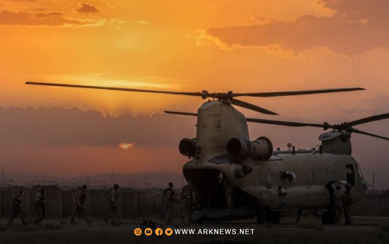 An American cargo plane lands at the base of the al-Omar field, east of Deir Ez-Zour