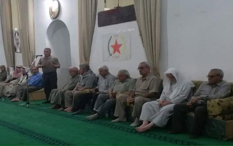 The PYD raises the pictures of Ocalan in Amouda mosque
