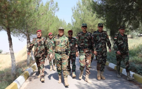 In pictures .. Commander of Roj Peshmerga force greets fighters in the fronts
