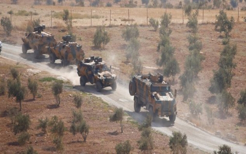 Turkish military forces stationed on the border opposite the city of Kobani city, Syrian Kurdistan